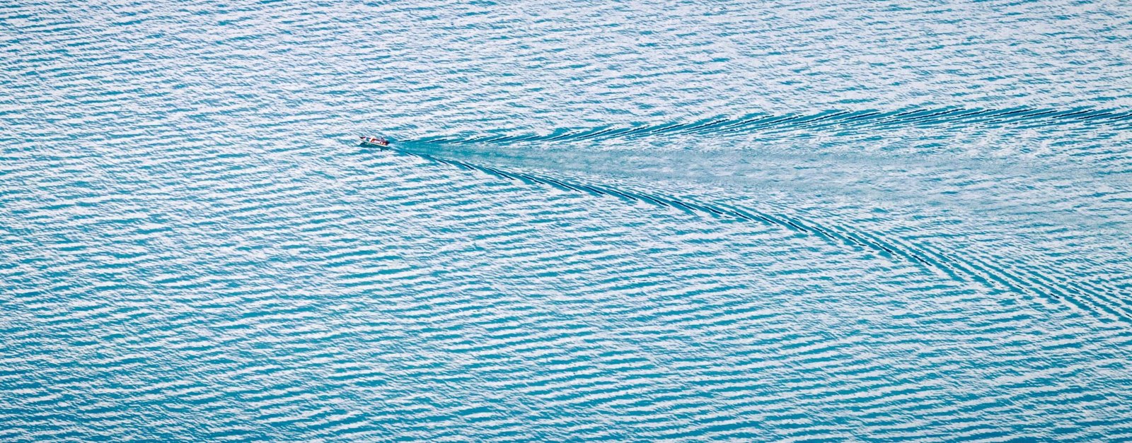A boat's wake across the water
