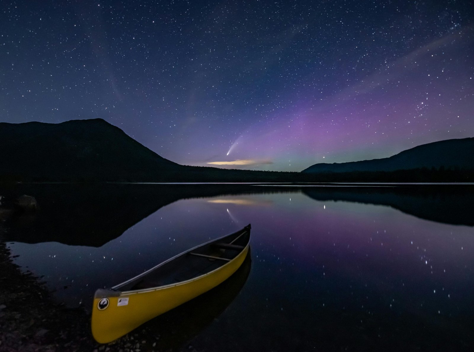 Boat on calm water at dusk