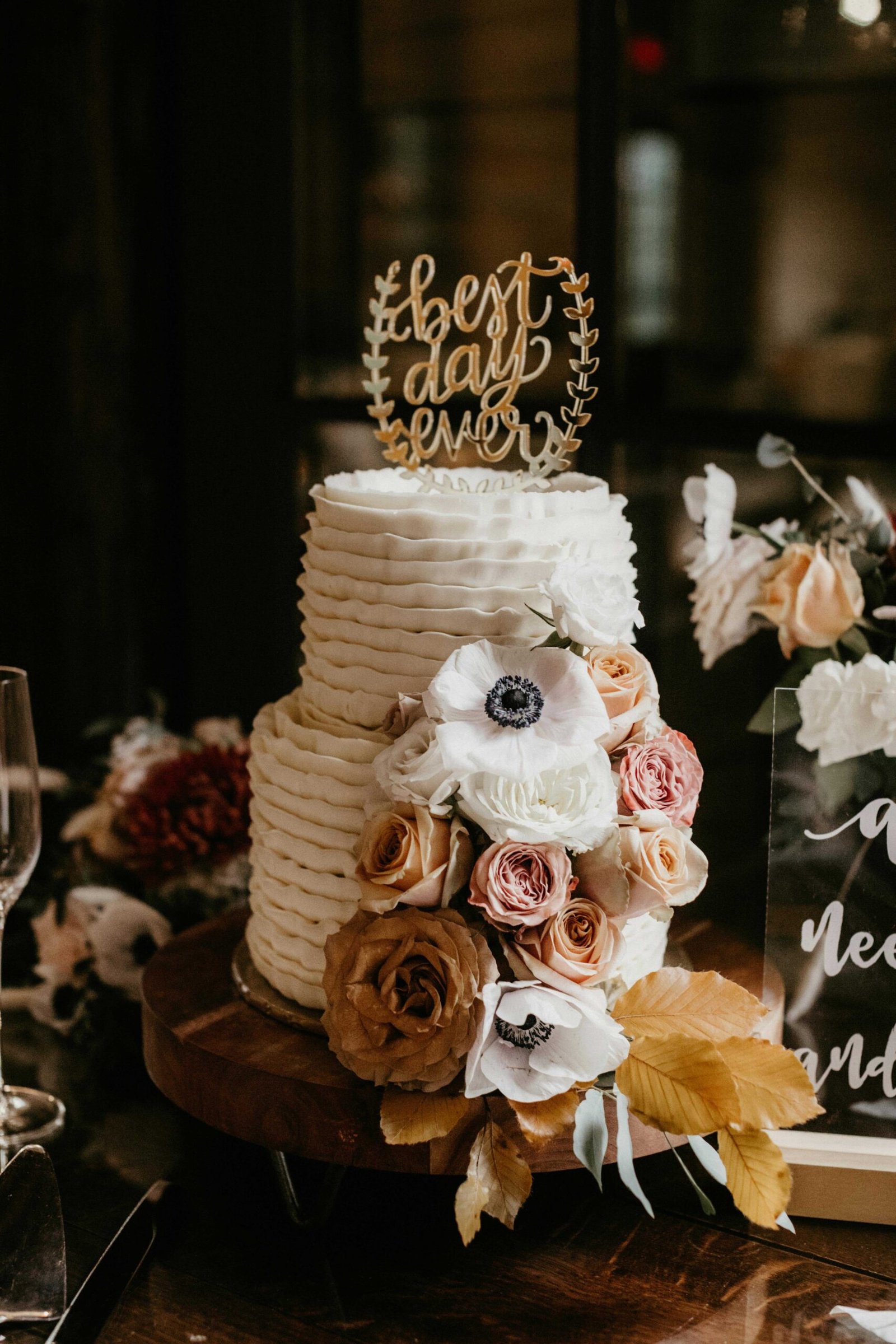 A wedding cake decorated with flowers
