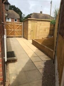 Garden landscaping, fencing, shed installation and patio.